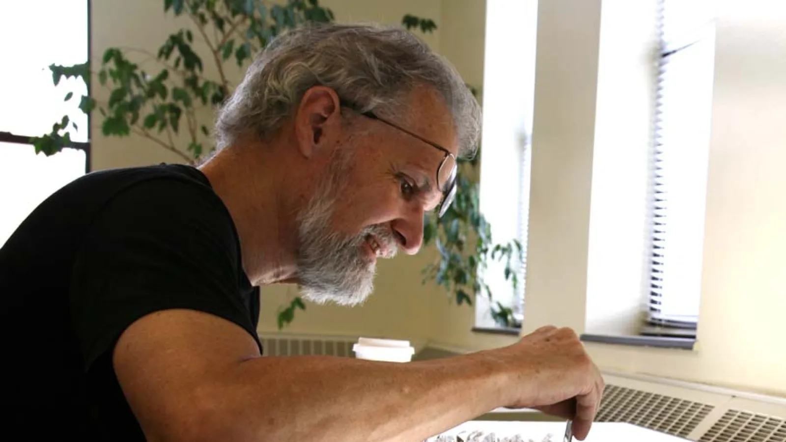 Howard Crane looking at art history slides