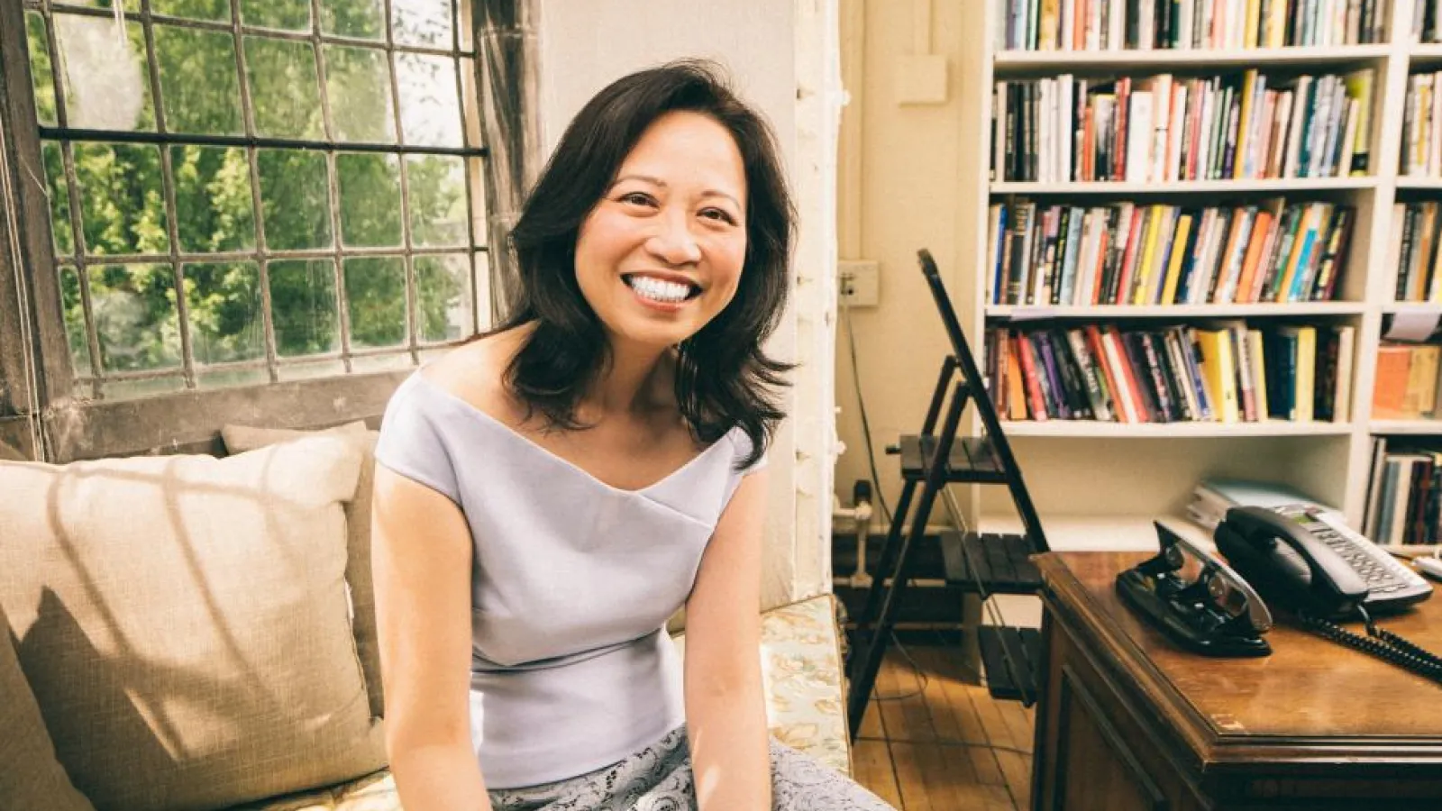 woman smiling in study