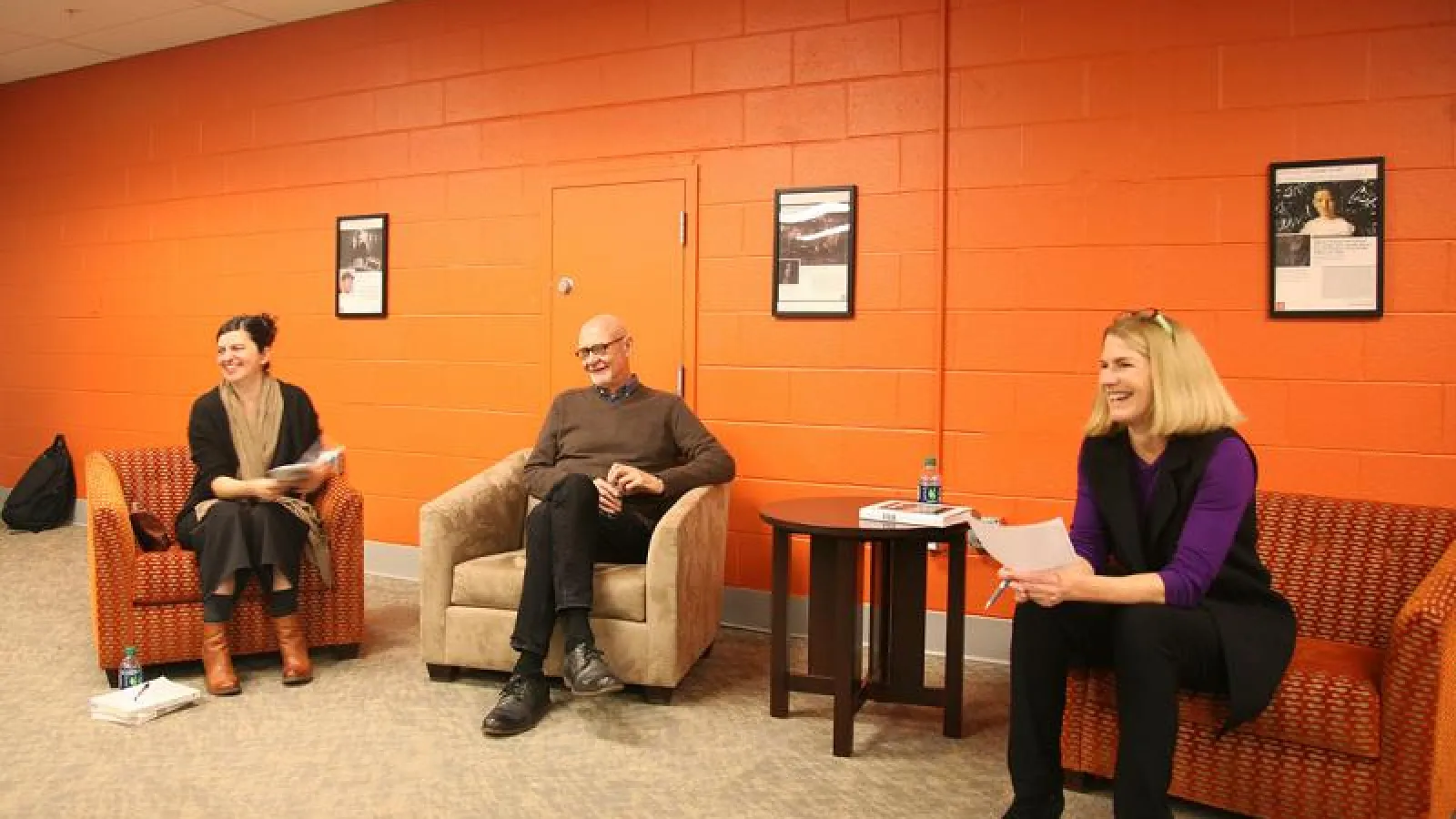 3 people on chairs informal lecture event
