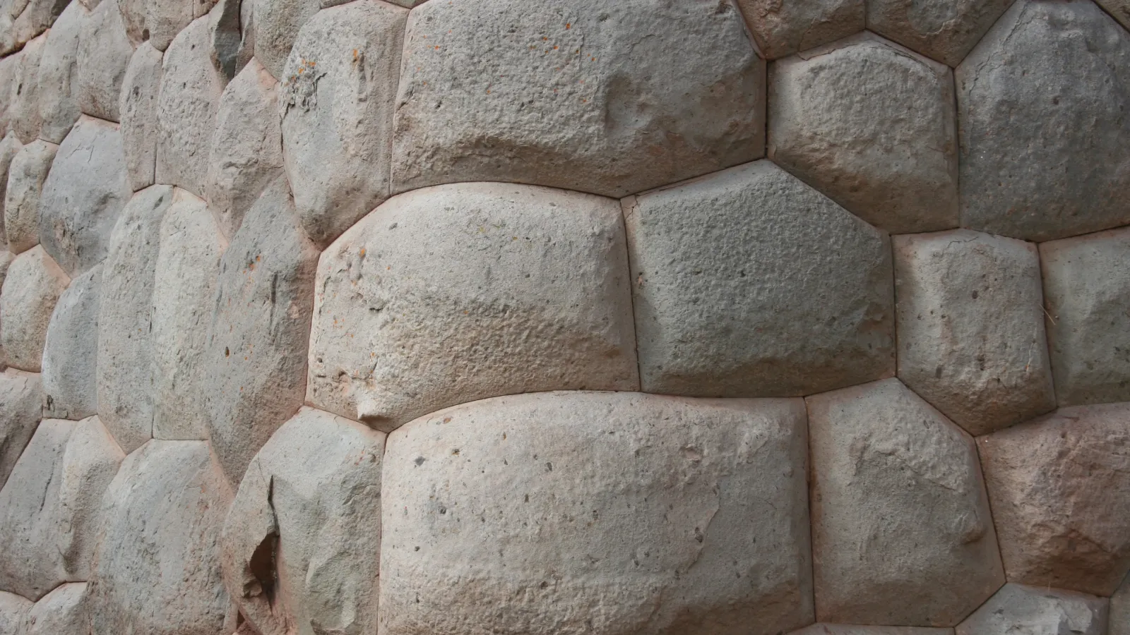a sandy stone wall. 