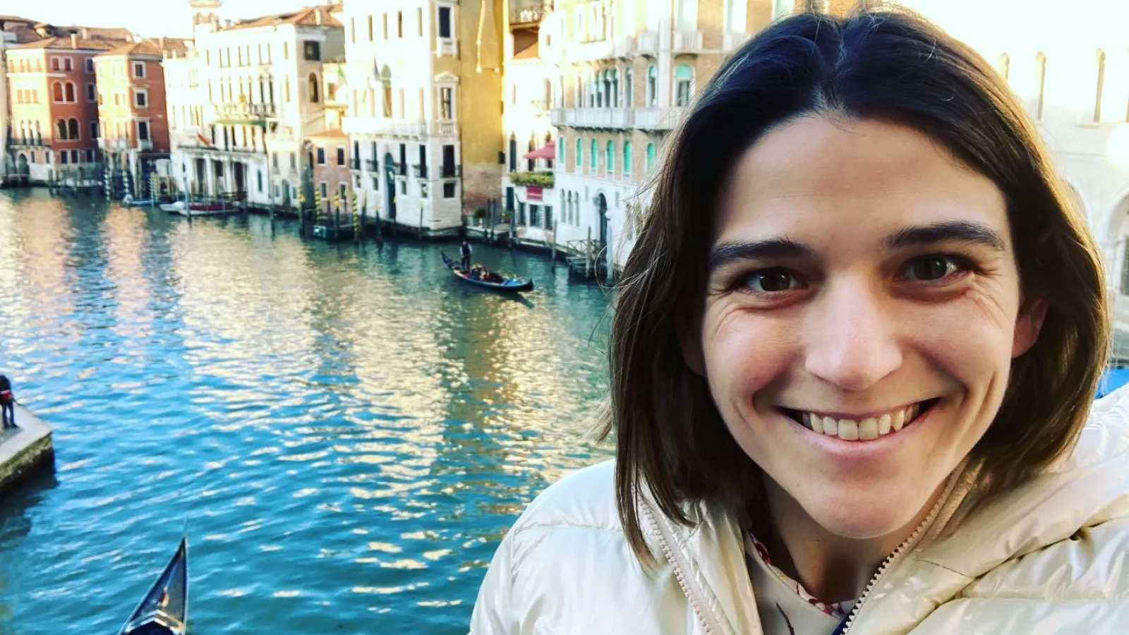 Caroline in front of buildings in Venice 
