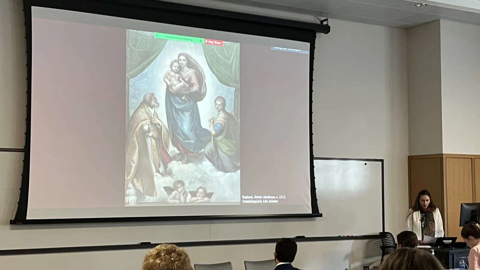 Presentation screen showing image of Raphael along with speaker
