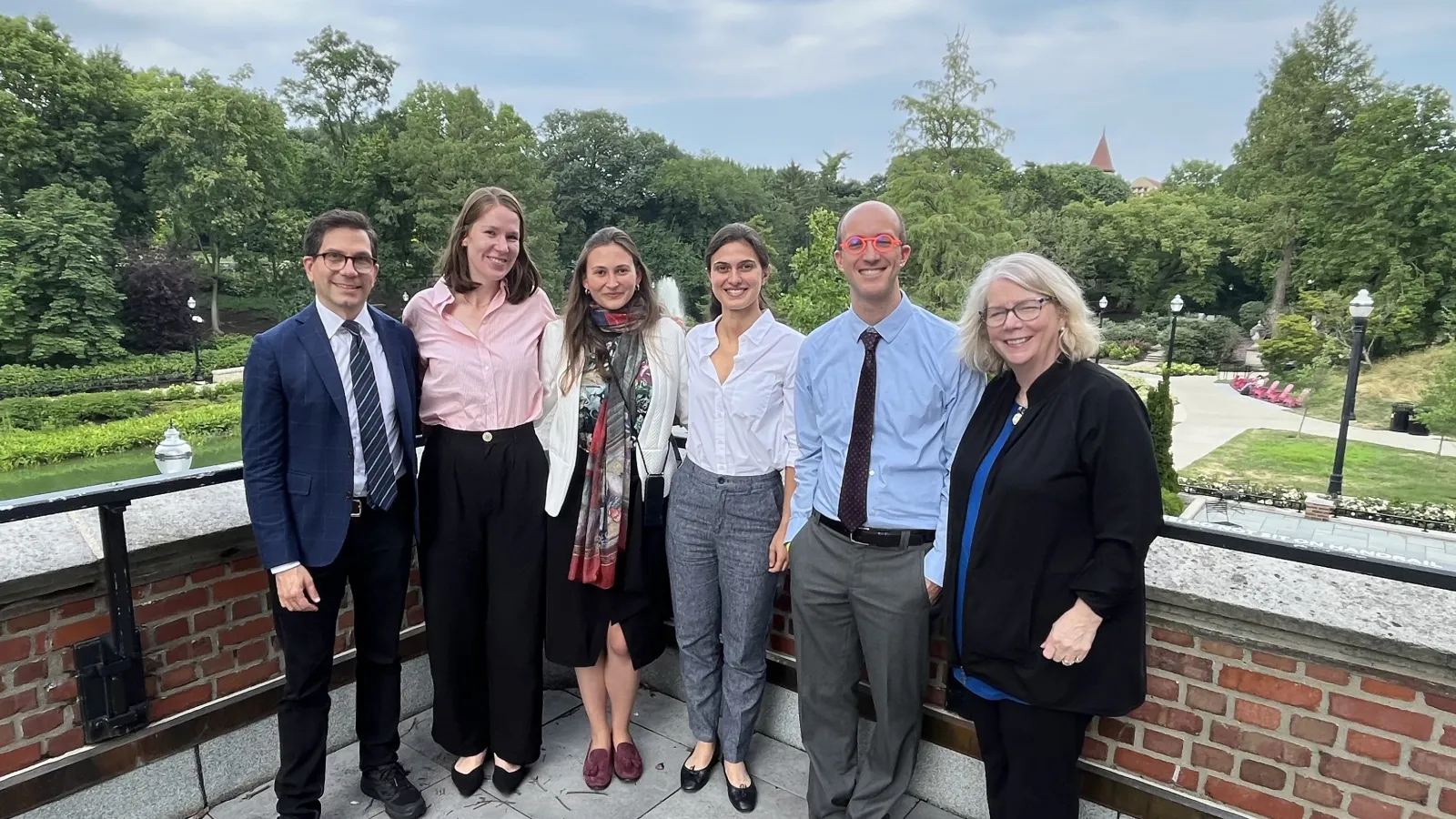Speakers and Director of CMA and Chair of History of Art pose by Mirror Lake
