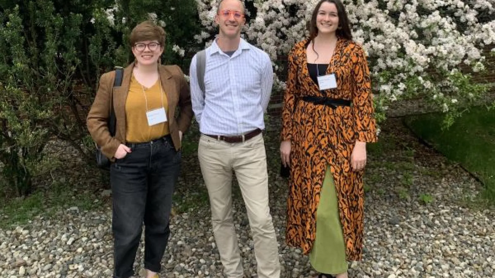 Margaret Wilson, Emilela Thomas-Adams, and Karl Whittington stand in front of trees