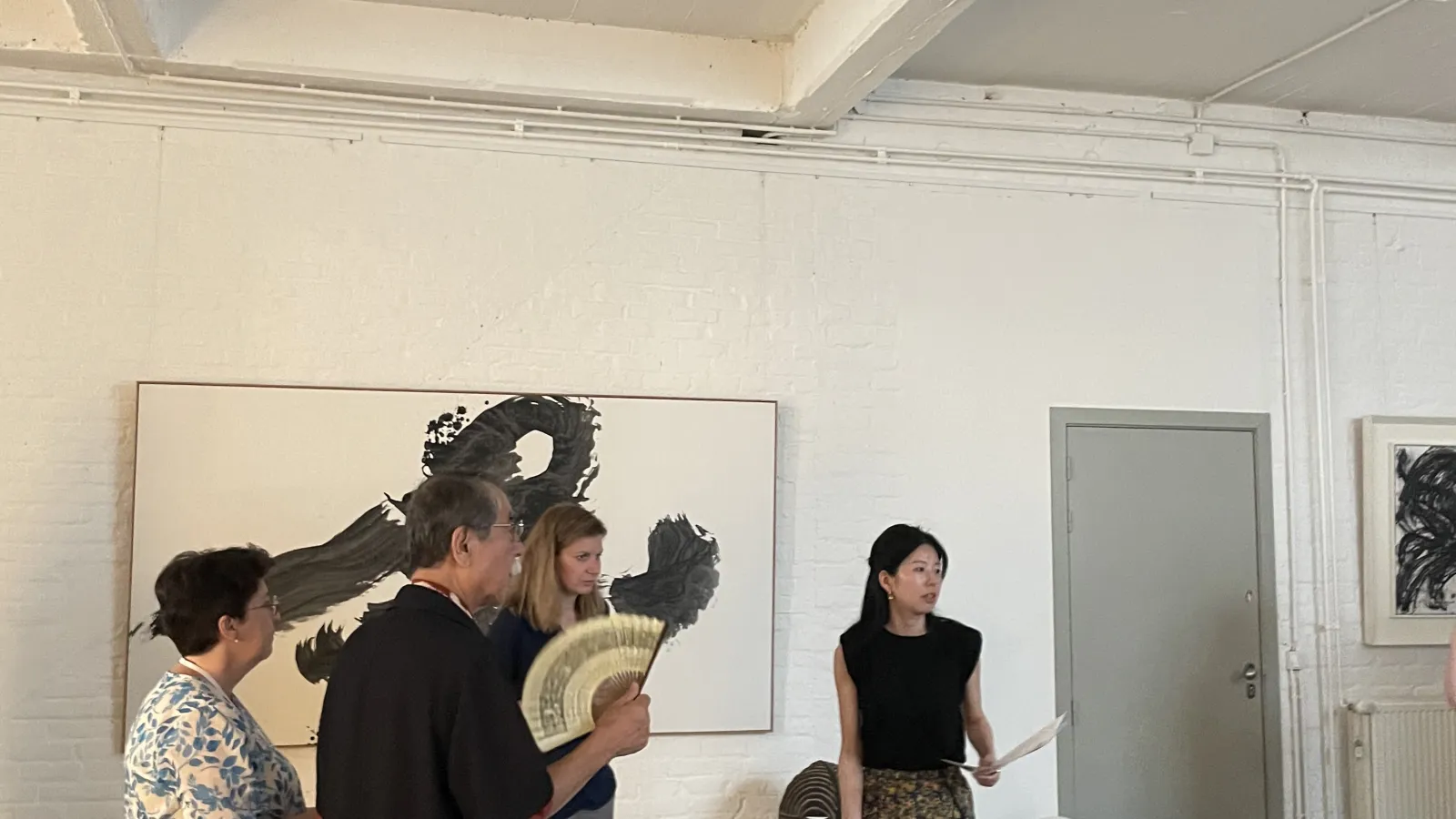 The group of art history professors and graduate students viewing the Gregg Baker Japanese art collection