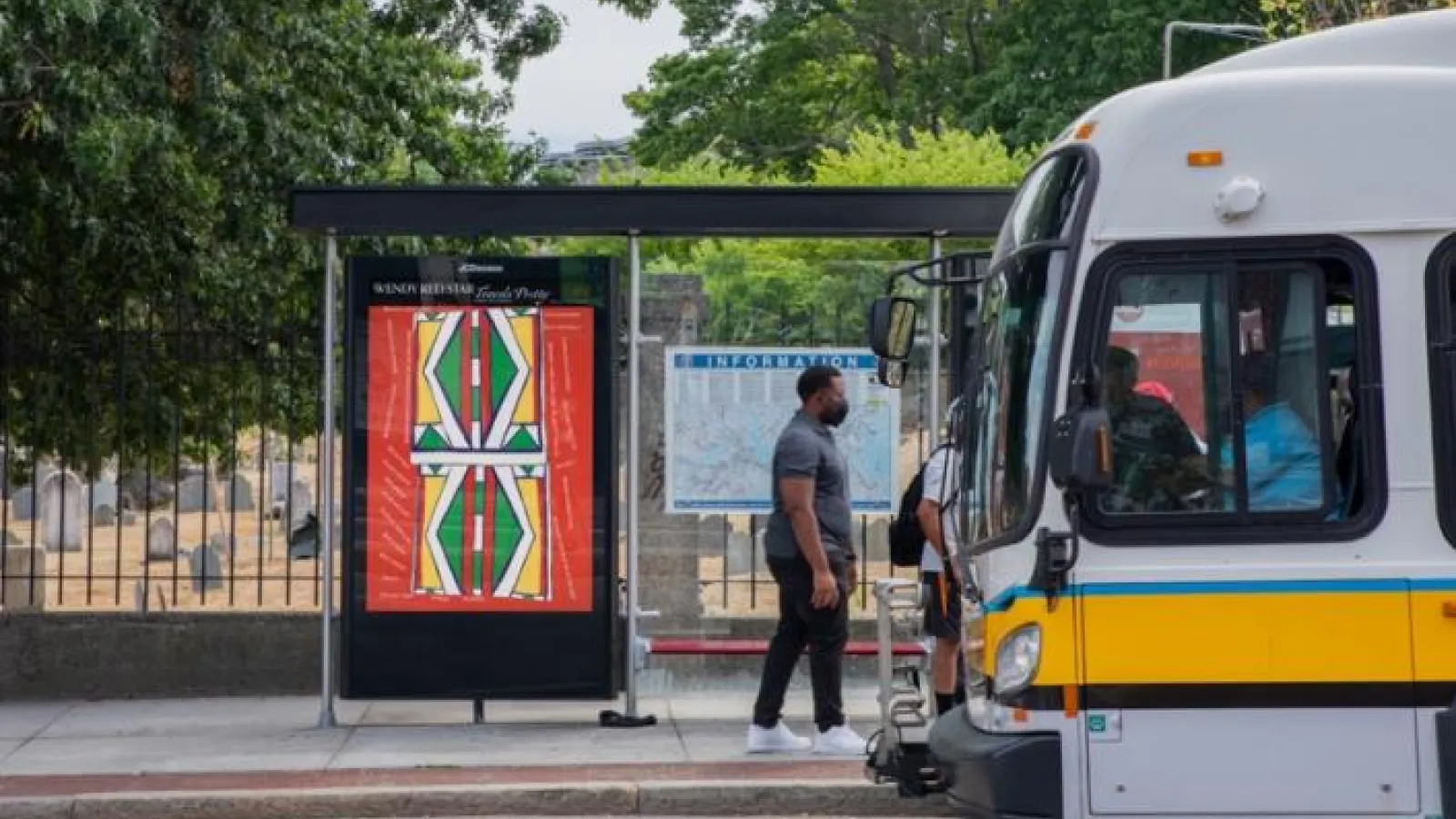 A bus parked at a bus stop 
