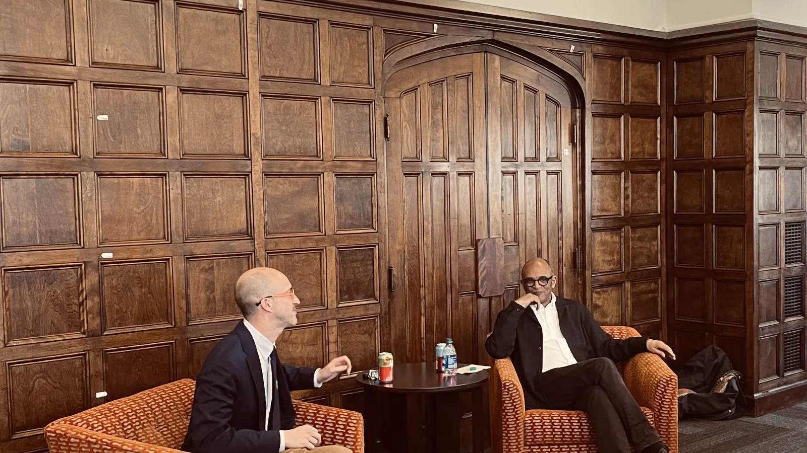 Dr. Nelson and Professor Whittington siting down and having a discussion