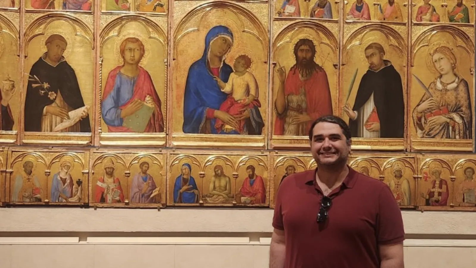 Tony Del Aversano standing next to Simone Martini, Saint Catherine of Alexandria Polyptych, 1320, Tempera and gold on panel, Pisa: Museo nazionale di San Matteo.