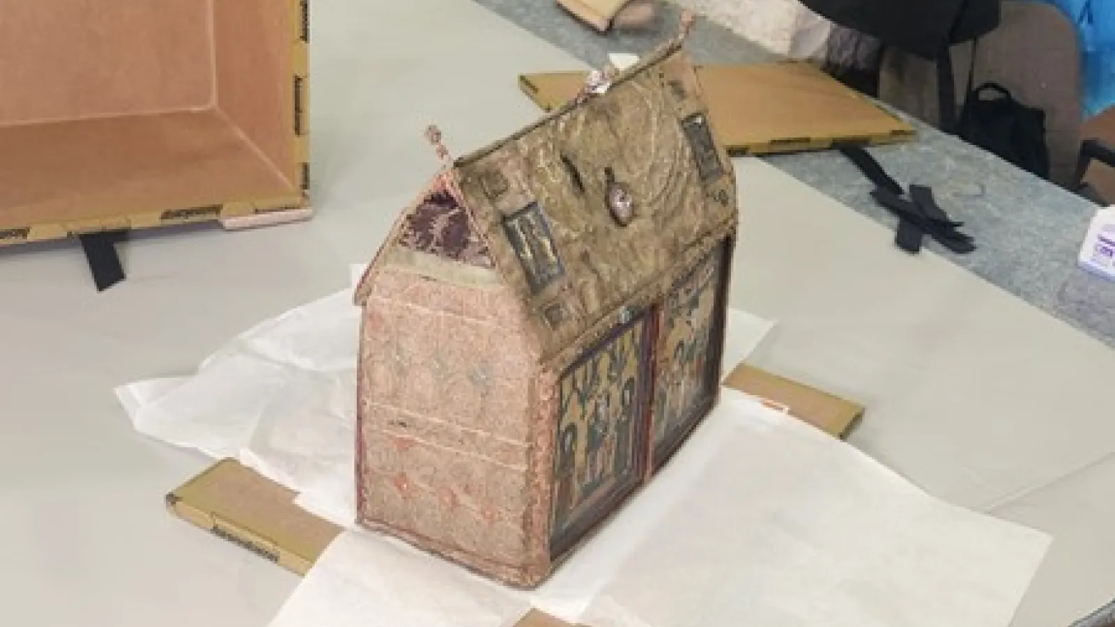 A textile reliquary on a table in an office