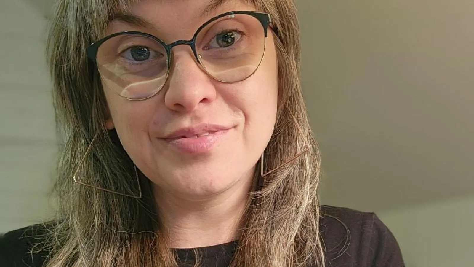 Dani Kissinger wearing a black top and glasses