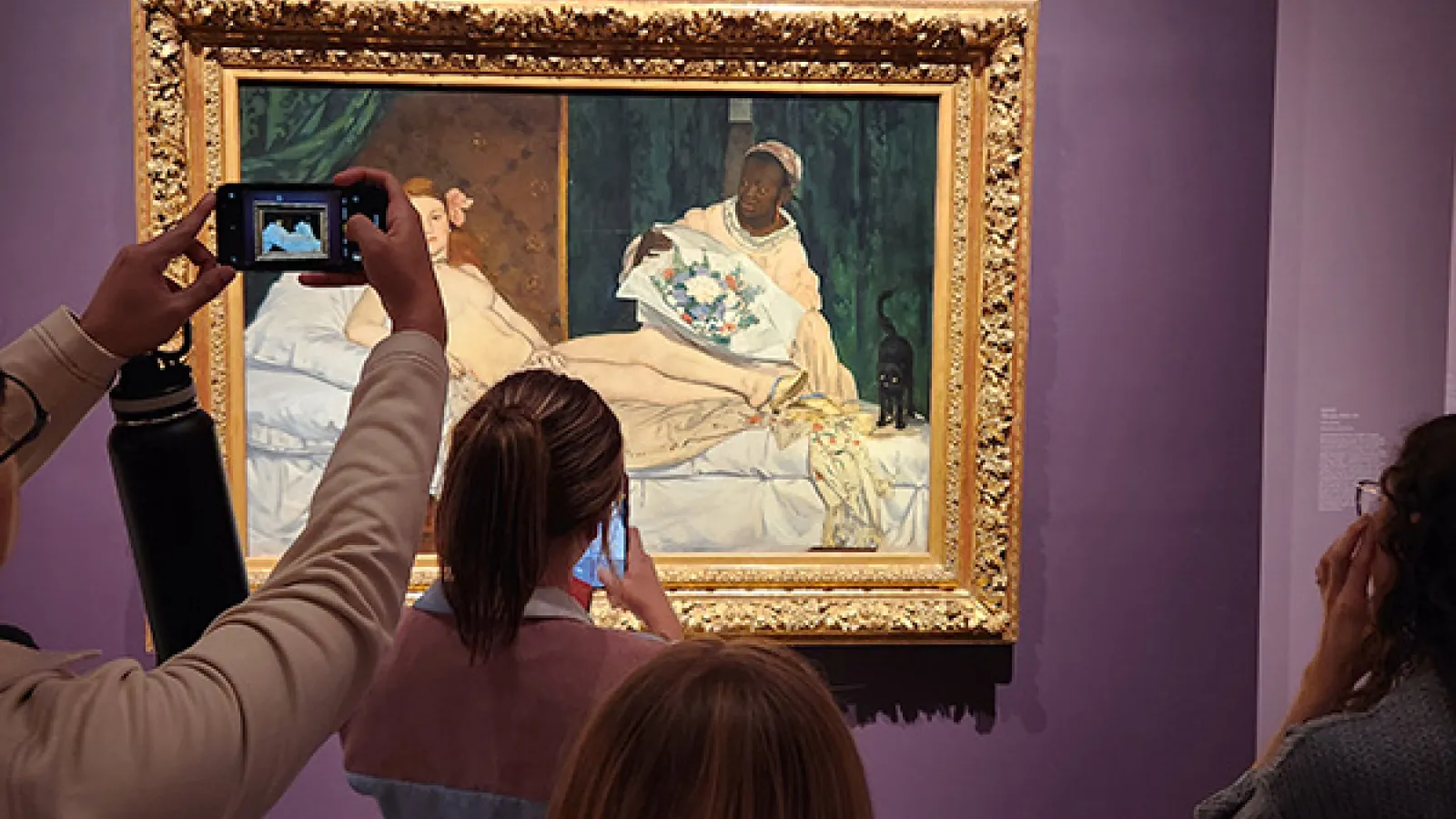 History of Art students viewing Manet's Olympia at the Metropolitan Museum of Art in New York