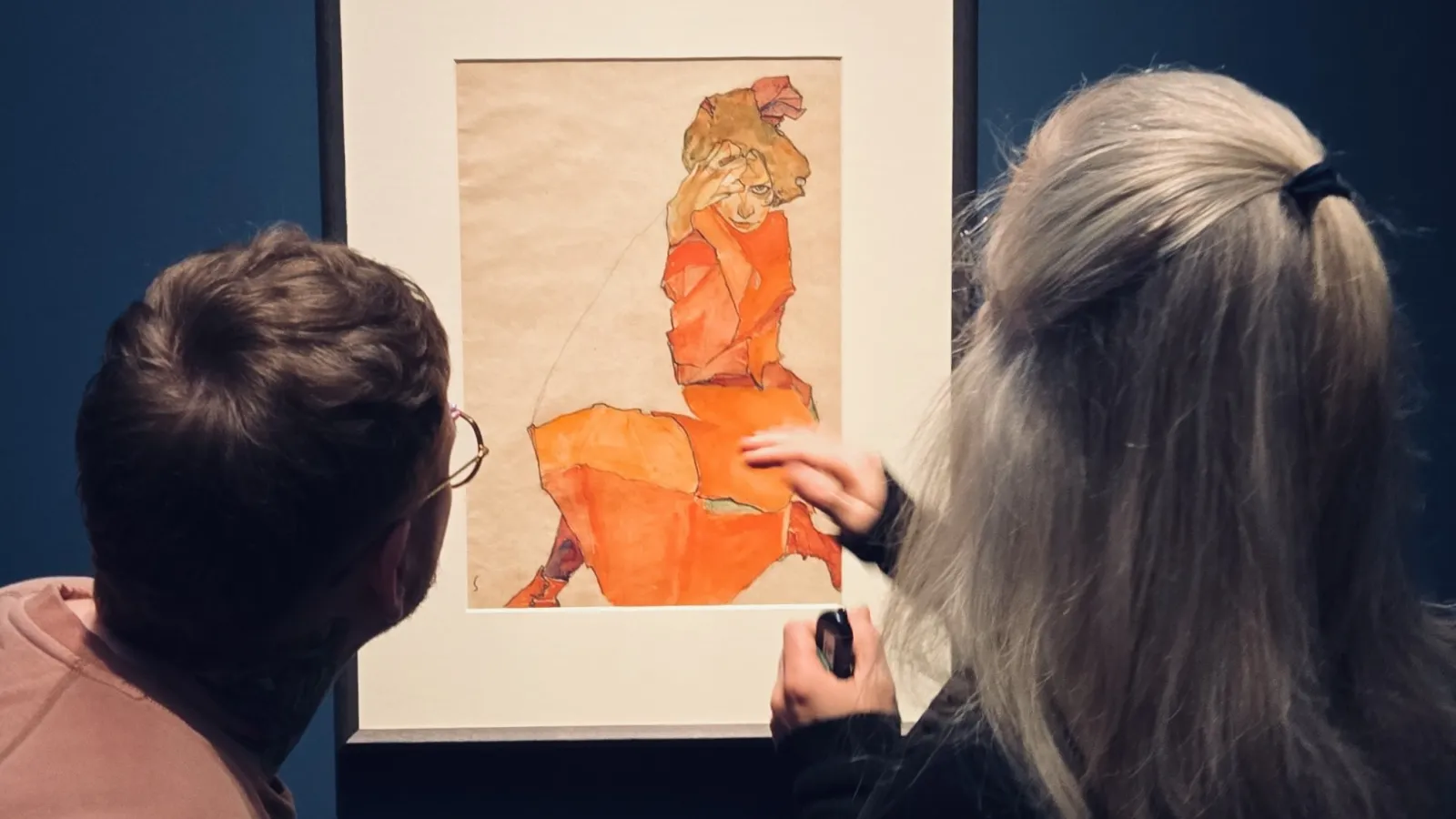 Cole and Kerstin looking at a piece