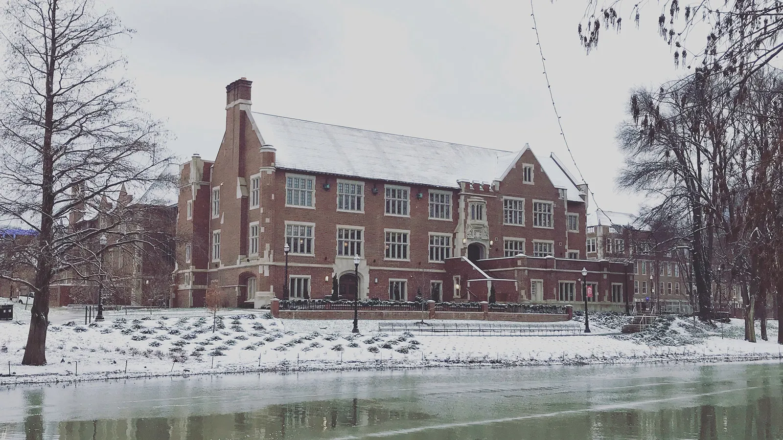 Pomerene Hall, home of the History of Art Department, viewed on a winter's day with Mirror Lake in the foreground