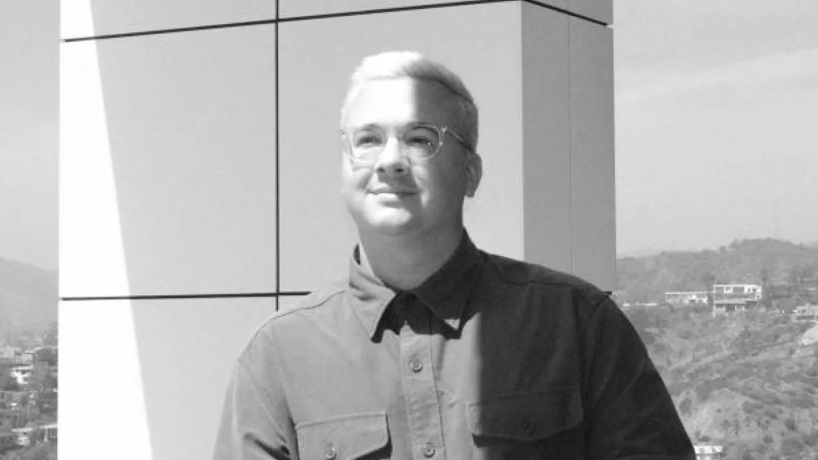 A black and white image of Dr. Katzeman on a balcony