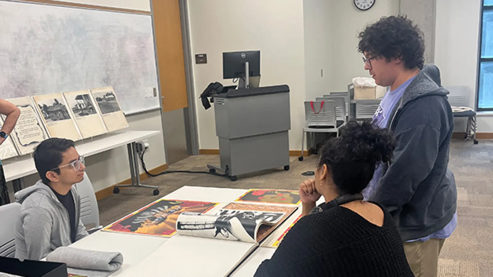 Students viewing and discussing works from the collections. 