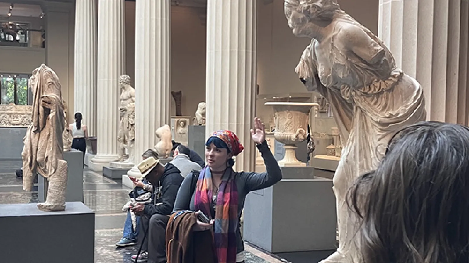 Students discuss statue 