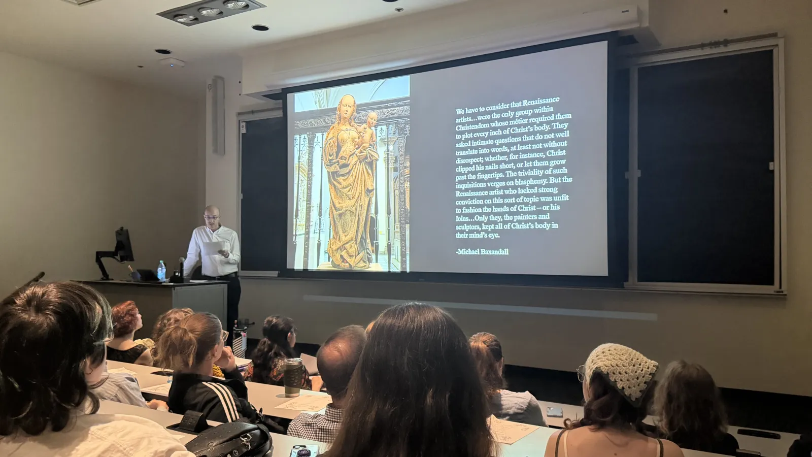 Karl presenting his slideshow on a screen