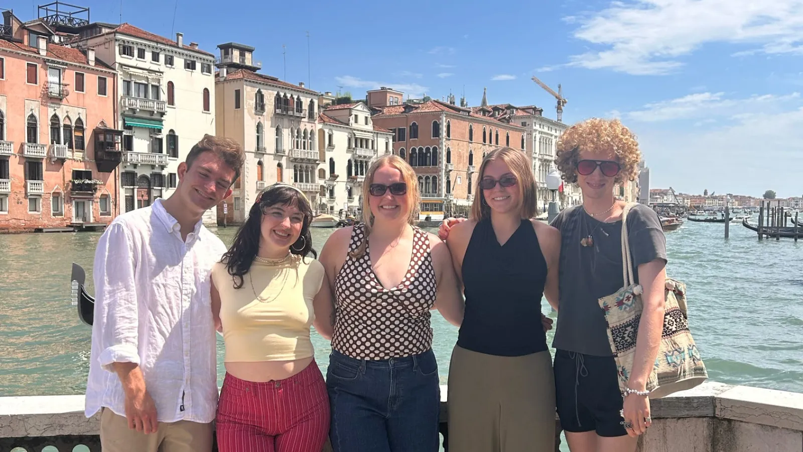 Students stand in front of Venice canal