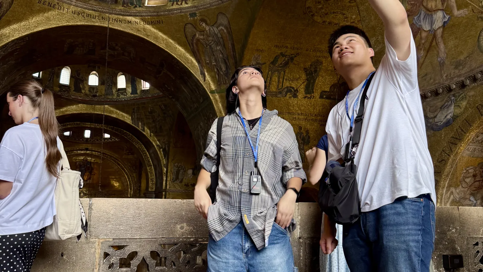 Two students stand in historic building