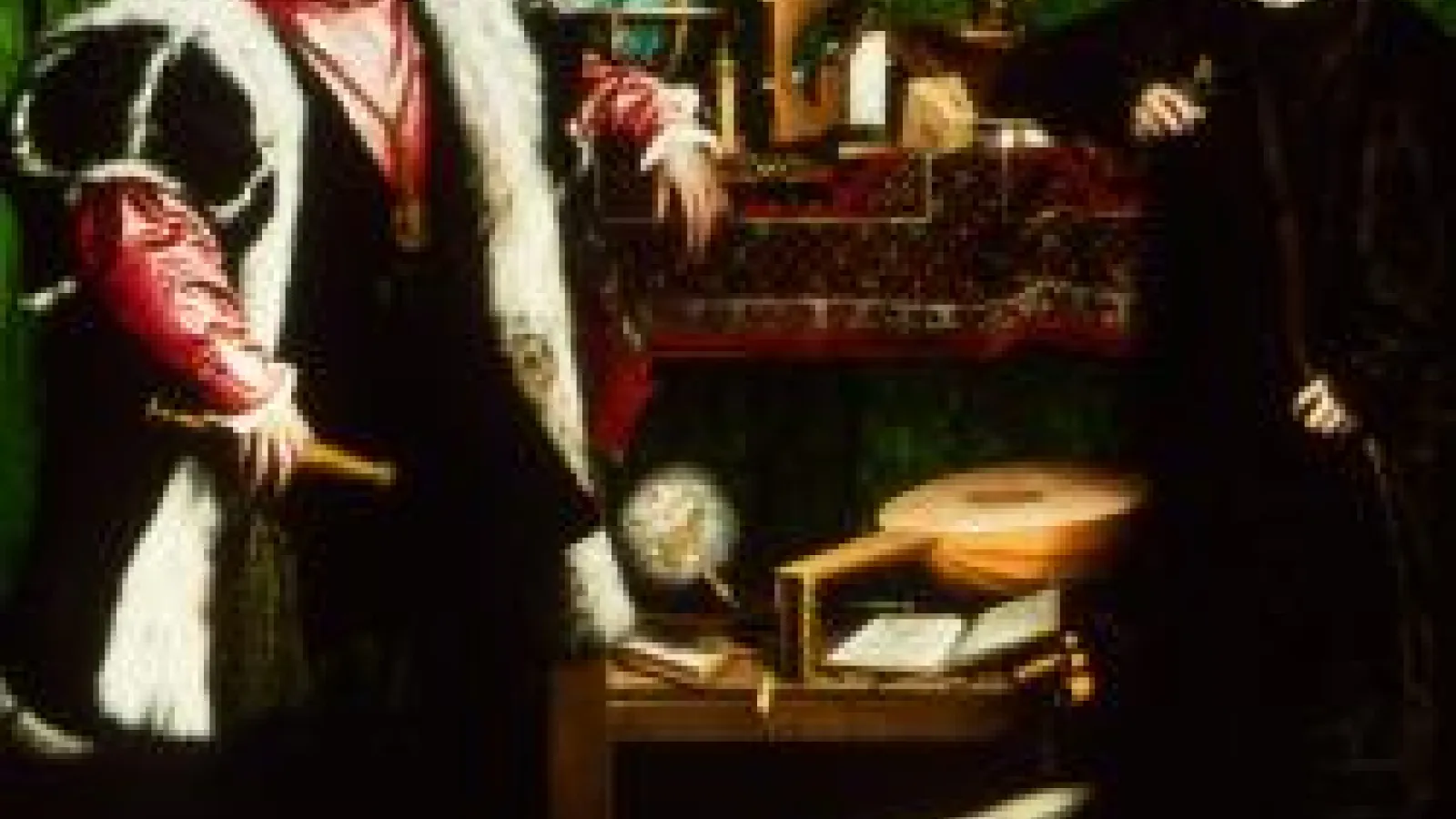 two men standing next to each other with one of their elbows up and resting on the furniture behind them