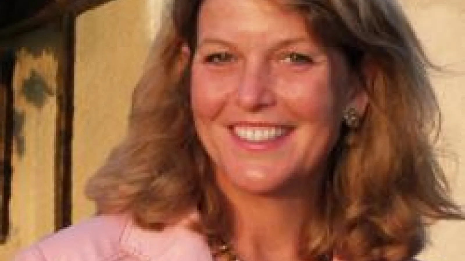 Joan Breton Connelly wearing pink blazer 