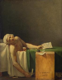 A man lying in a bathtub with a letter in his hand