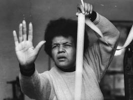 A woman holding a strip of film