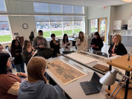 students viewing artwork in conservation area