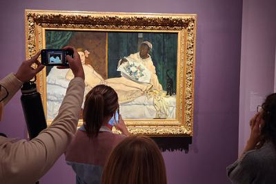 History of Art students viewing Manet's Olympia at the Metropolitan Museum of Art in New York