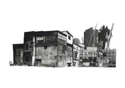 A black and white photo of a building with a palm tree.