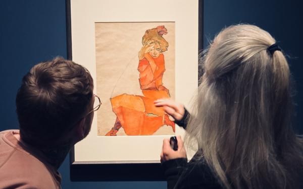 Cole and Kerstin looking at a piece