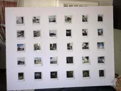 A collection of photos displayed on a white wall.