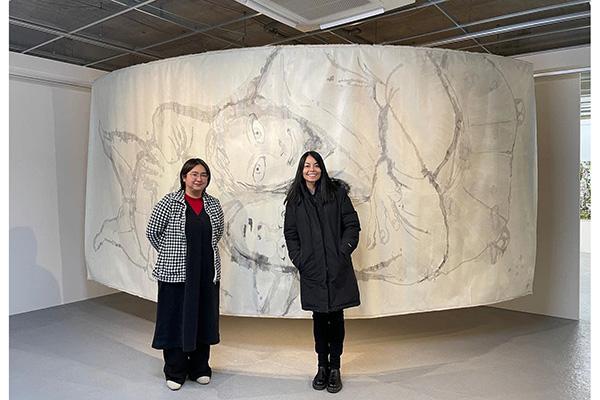 Namiko and artist Goto Yasuka in front of her work, Spica, at the Miyauchi Art Gallery in Hiroshima