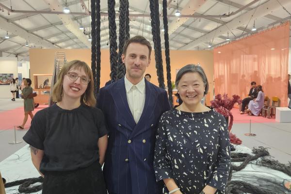 Allie Mickle at the art fair Art Central with Fair Director Corey Andrew Barr and ASHK President S. Alice Mong, both OSU alumni