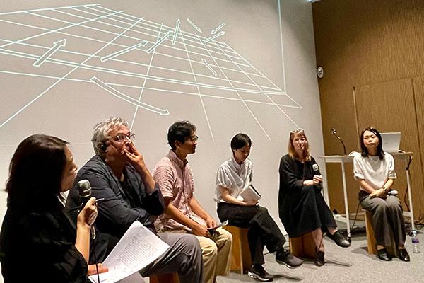 Photograph of Paulsen with fellow speakers and scholars of Paik's work. 