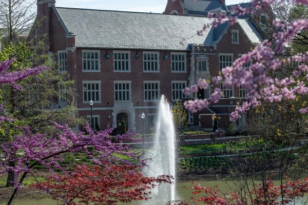 Pomerene Hall, home of the History of Art Department, seen on a spring day with Mirror Lake in the foreground