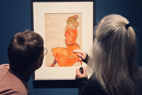 Cole and Kerstin looking at a piece