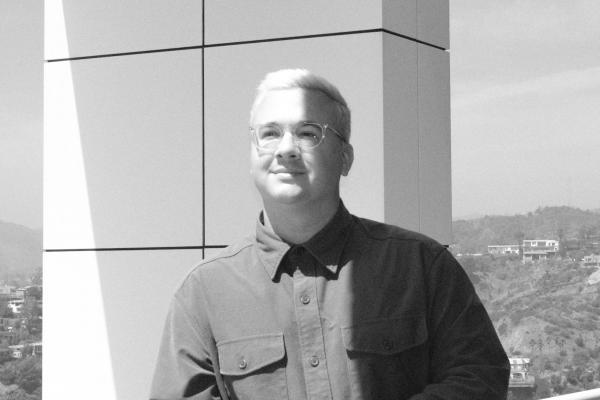 A black and white image of Dr. Katzeman on a balcony
