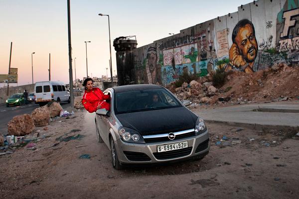 speed sisters still - woman in red jumpsuit out of car window