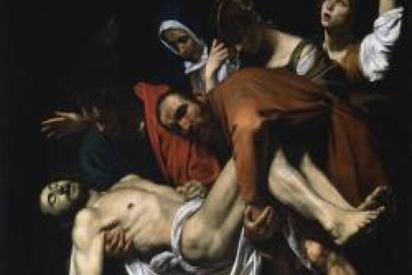 "The Entombment of Christ" painted by Caravaggio. A man is holding a deceased Jesus while a nun and two women pray and mourn behind him