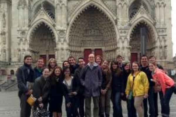 Karl Whittington and a group of students in front of architecture abroad
