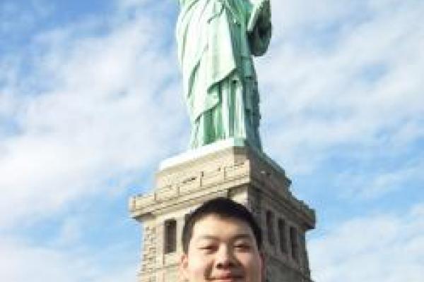 Yanfei Zhu in front of the Statue of Liberty