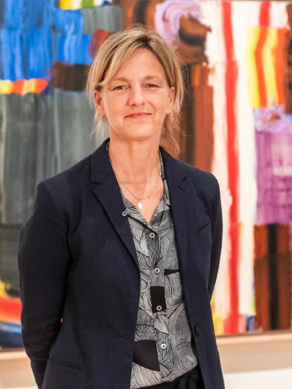 image of jody patterson in front of lichtenstein painting