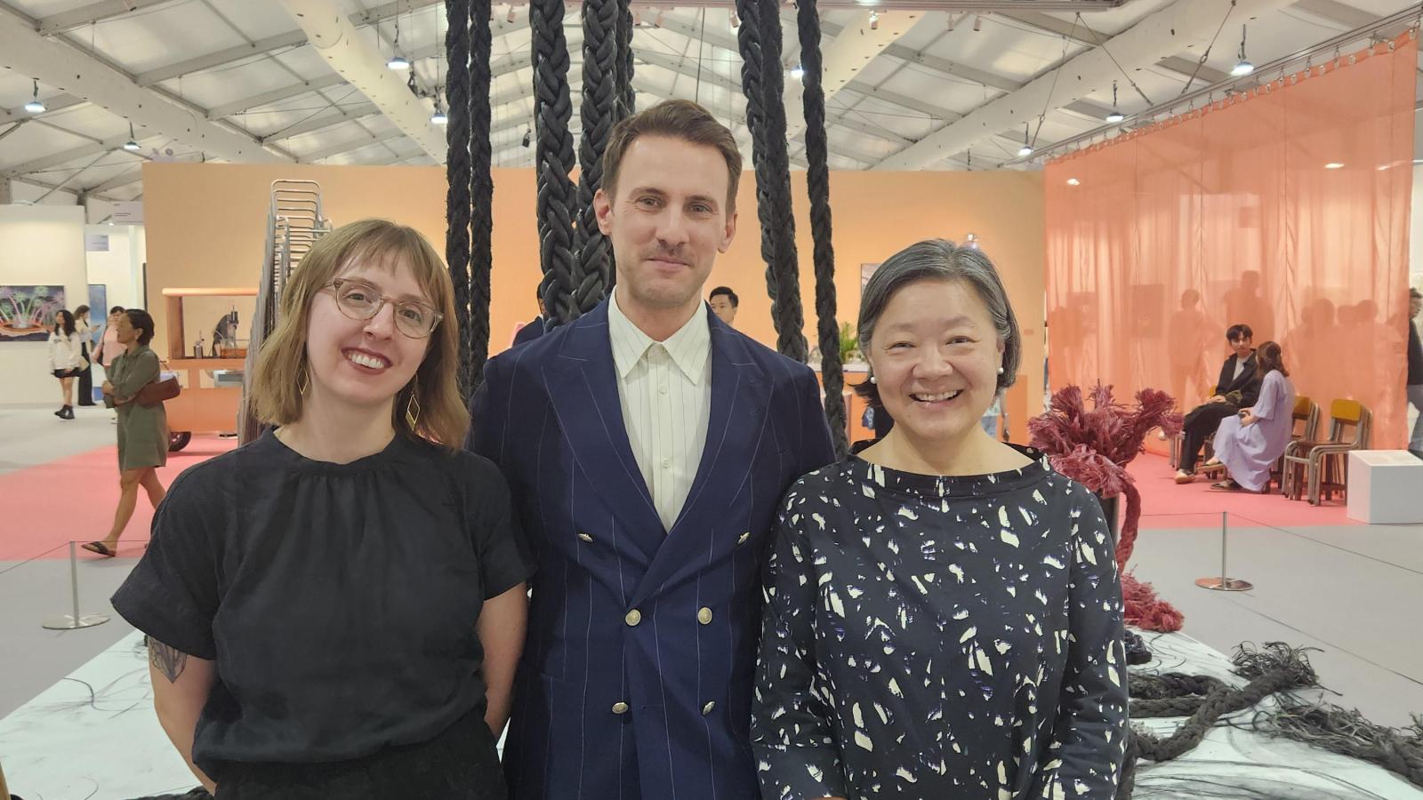 Allie Mickle at the art fair Art Central with Fair Director Corey Andrew Barr and ASHK President S. Alice Mong, both OSU alumni