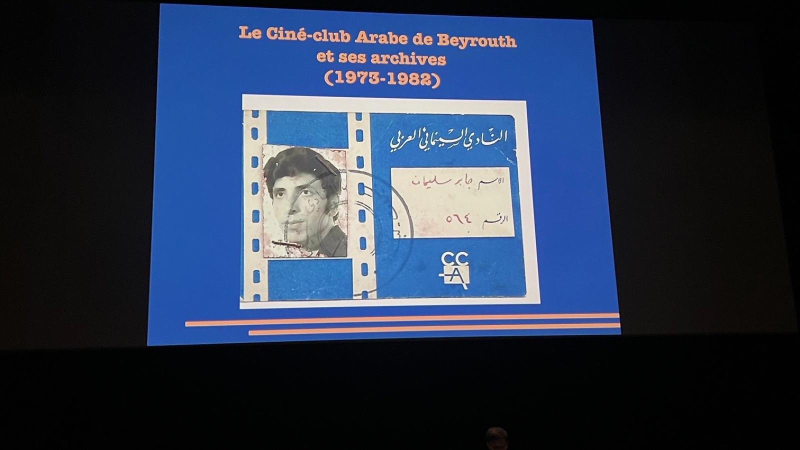 Anais Farine delivering a talk at a podium at the Festival Cine Palestine