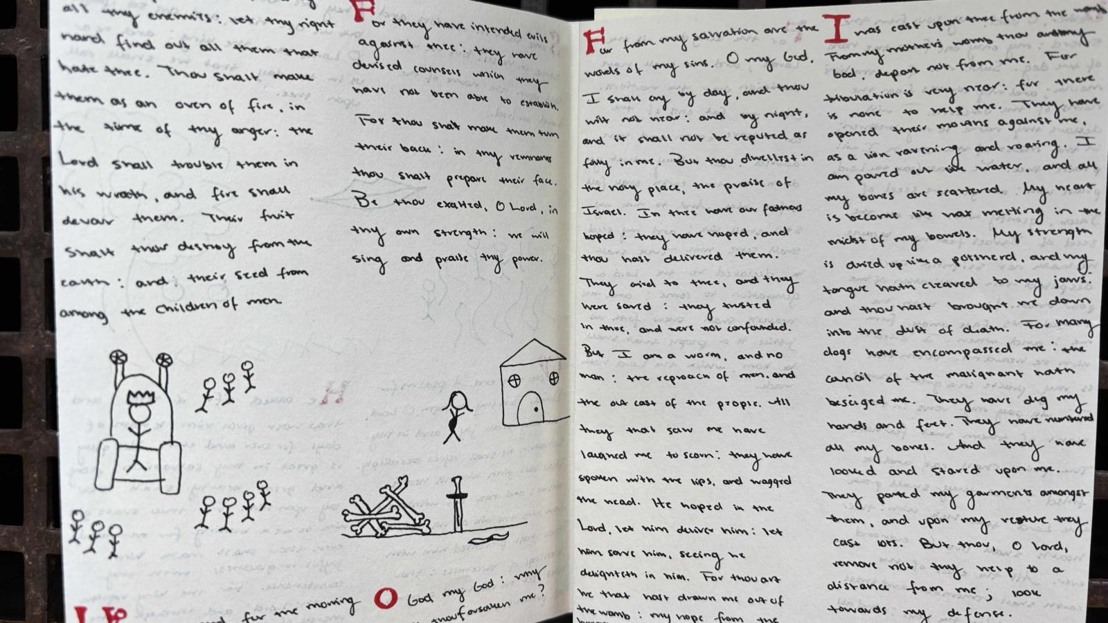 two open pages of text with small drawings, one of a house