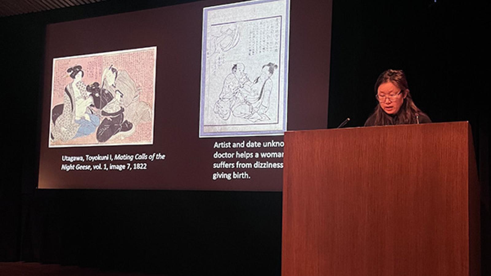 Christy Sher presenting at the symposium