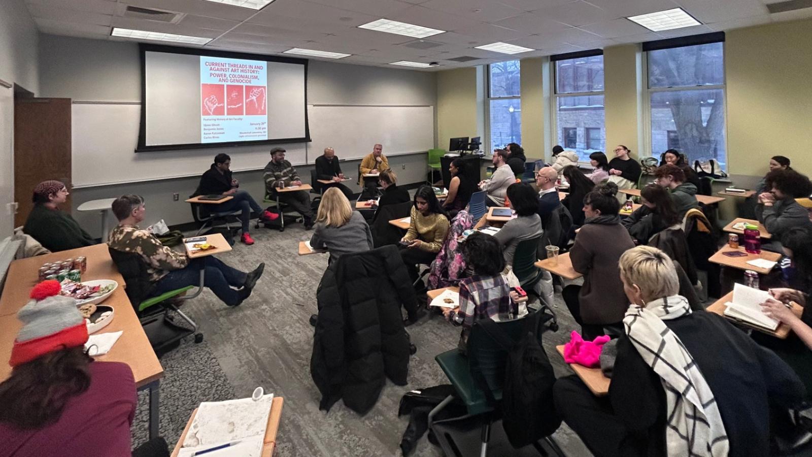 classroom full of people all facing the board