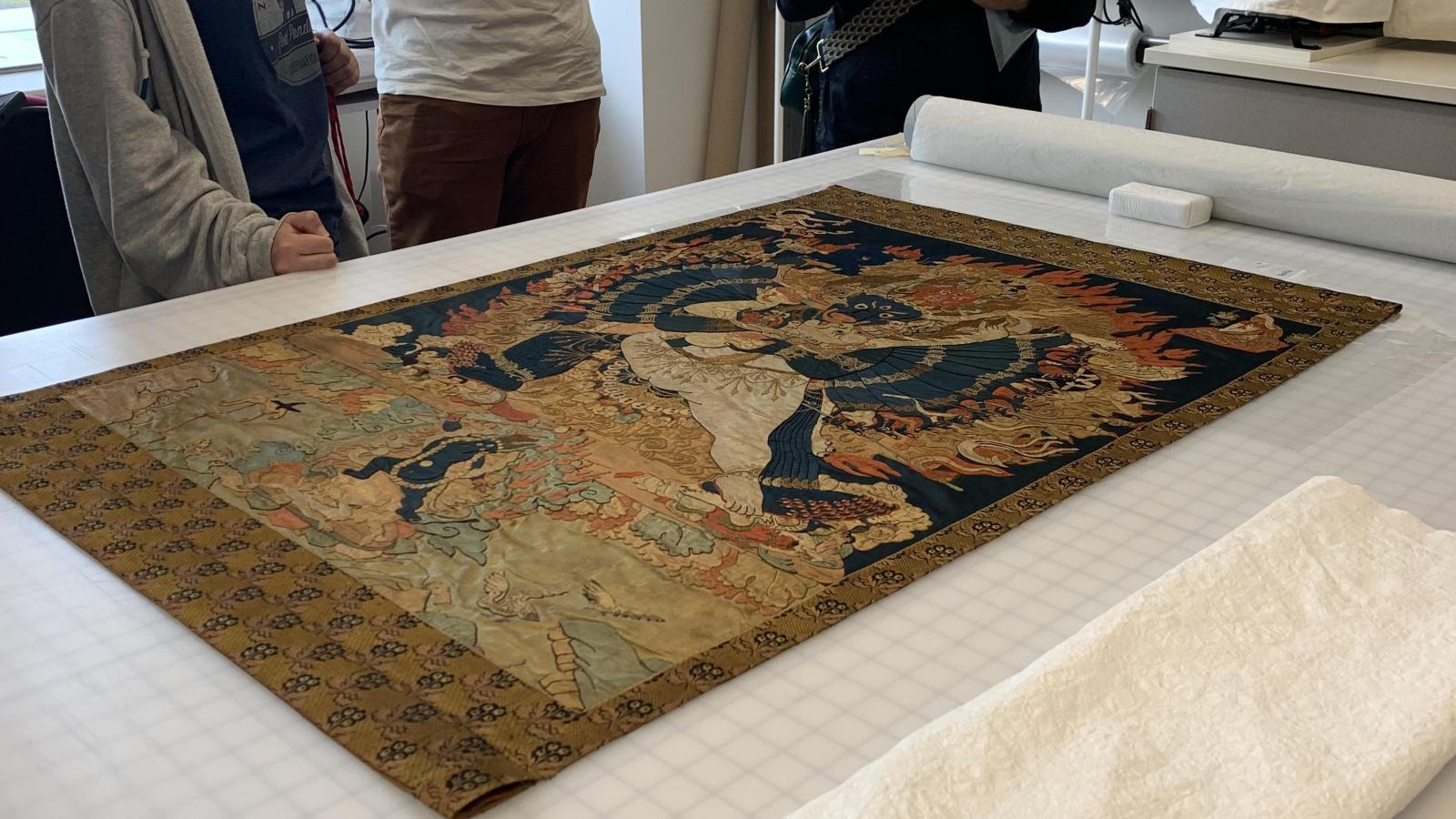 people looking down at a table