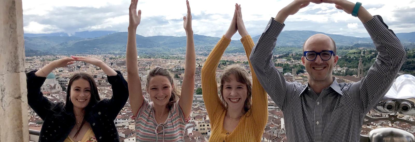 students and professor spelling OHIO in Italy